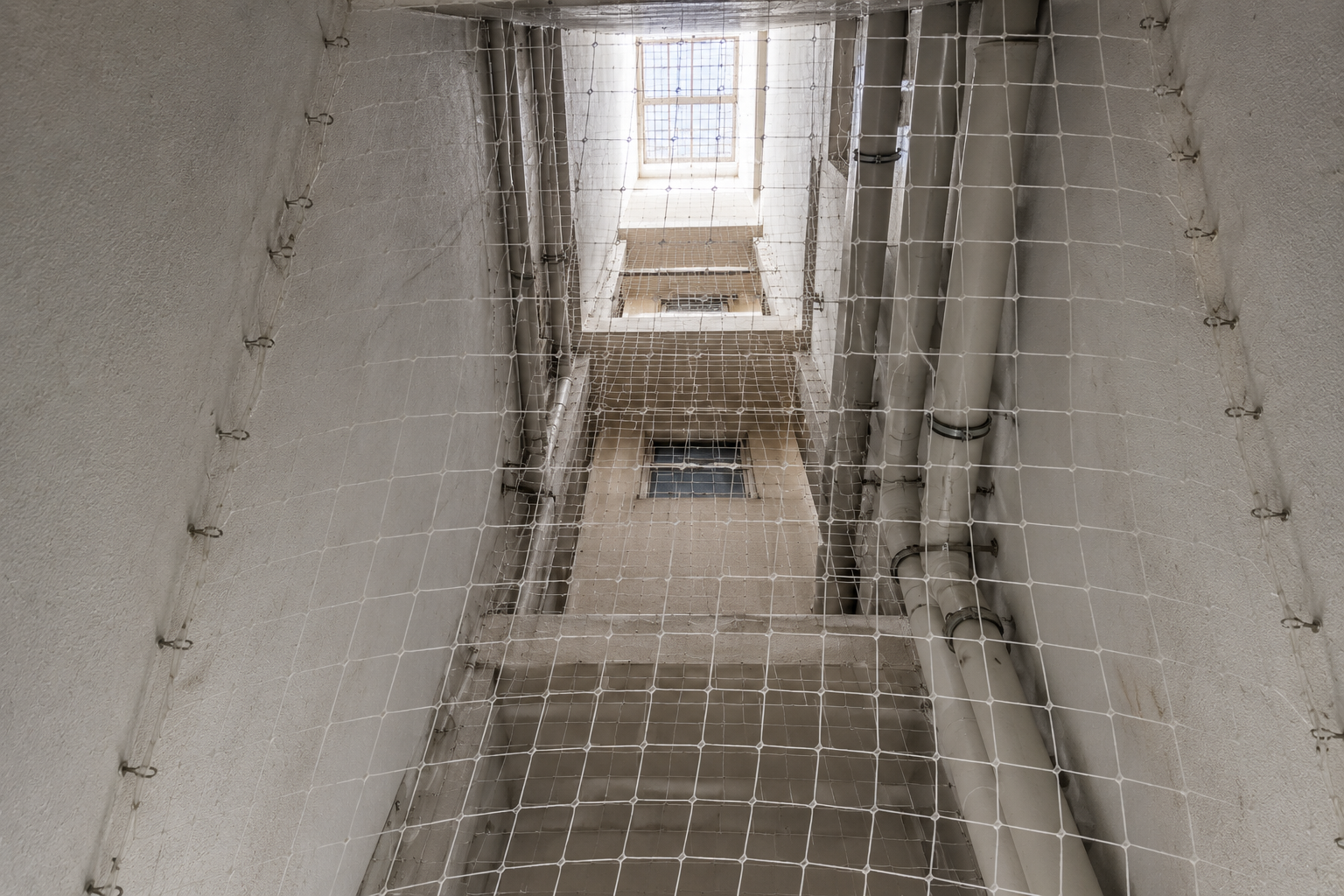 Duct area safety net installation for apartment utility and service spaces